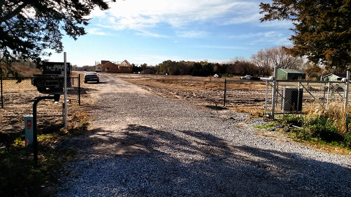 Chain link automated slide gate for rural residential property. Fargo fence company fence contractors North Dakota gates automation repair gate operator residential commercial