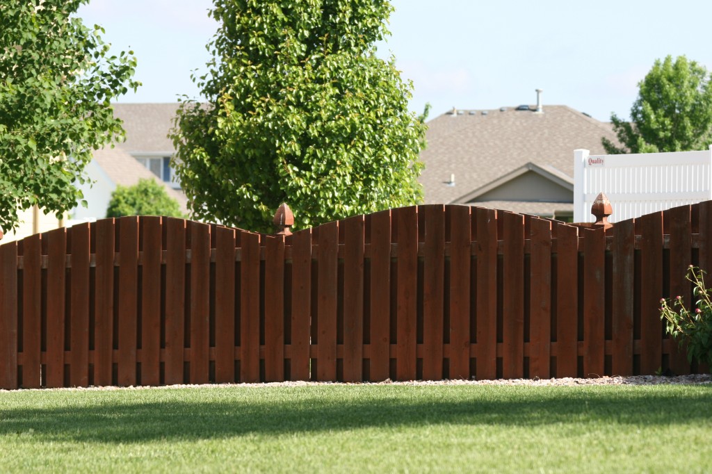 American Fence Company Sioux City, Iowa - Wood Fencing, 1002 4' overscallop picket stained
