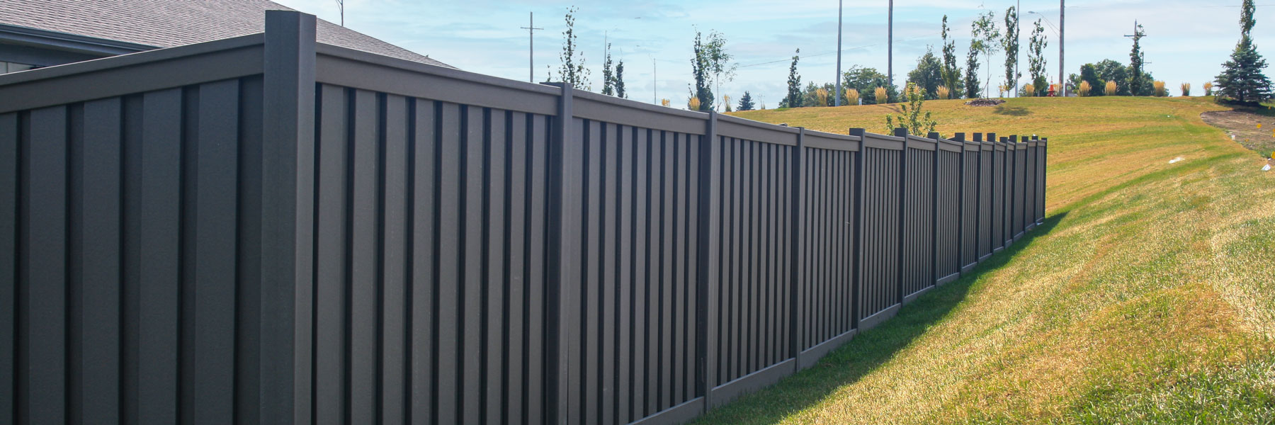 Fargo fence company commercial fence contractors North Dakota board on board shadow box picket alternating staggered wood vinyl tan sandstone white sandstone khaki cracking chipping splitting UVB residential backyard perimeter security visibility solid