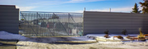 Fargo fencing company commercial fence contractor North Dakota double single cantilever roller slide vertical lift vertical pivot ornamental picket decorative chain link security commercial industrial correctional prison manufacturing hinges hardware swing drive way estate perimeter