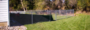 Fargo fence company chain link fence residential fencing contractors North Dakota industrial high security recreational sport ballfield tennis court basketball pickleball football high school college playground chain link gate posts tubing pipe top rail chain link fabric wire mesh galvanized aluminum vinyl coated black brown green 9 gauge fence fencing security perimeter hinges installation repair costs panels hardware fittings